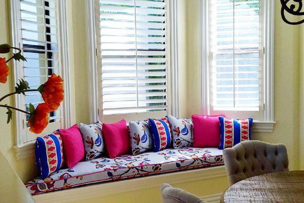 This custom window seat view is enhanced with fun fabrics in coordinating colors and patterns.