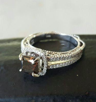 Chocolate diamond set in 14k white gold accented white round brilliant cut diamonds. Made in the USA