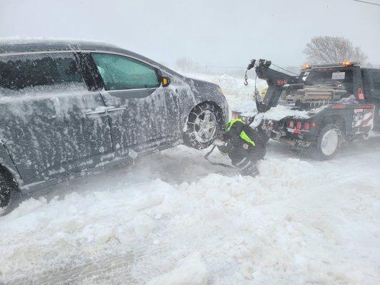 After the loader cleared out most of the snow, Joseph was able to hook us up