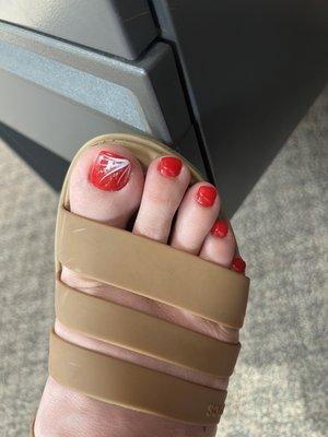 No chip red pedicure with line design on big toe