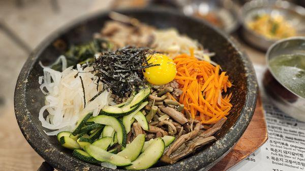 Solsot Bibimbab $20.95: Rice topped w/ 7 Namul, Beef, Egg Fry in Hot Stone Pot