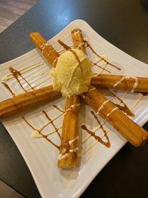 Churros with ice cream and caramel sauce