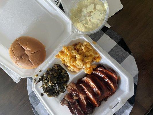 The chicken dinner with Mac and cheese, Greens, Potato Salad.