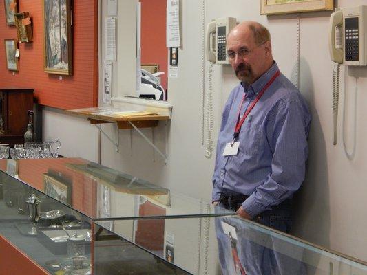 Showcases for jewelry and other small valuables, overseen by long-time employee, Richard