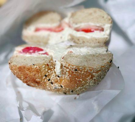 Sesame Bagel w/ cream cheese and tomato.