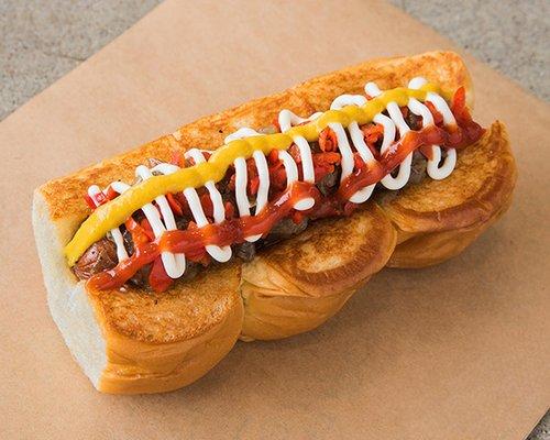 DOWNTOWN – smoked bacon wrapped dog, caramelized onions, pickled peppers, mayo, mustard, ketchup