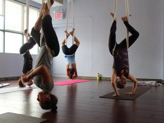 Hanging upside down is fun when you are supported with aerial hammocks!