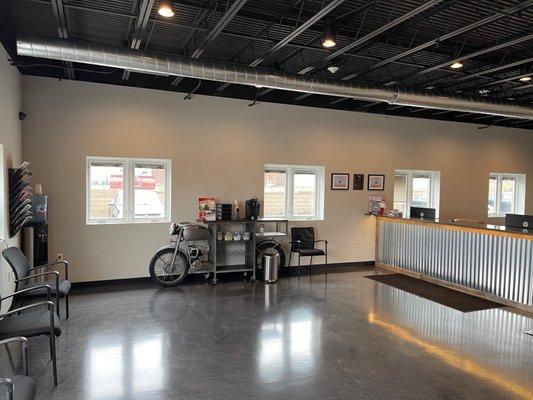 Waiting area with fresh coffee and water available. How cool is that bike!?