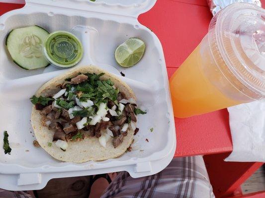 Beef cecina taco and cantaloupe juice