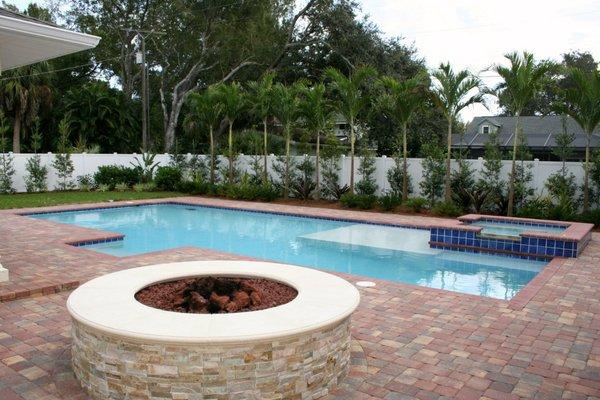 Fire pit installed next to pool. Perfect for chilly evenings in Naples.