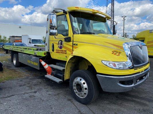 2020 International with refurb Miller Chevron rollback body supplied by East Penn Truck Equipment & body refurb-install by Ross Body Frame.