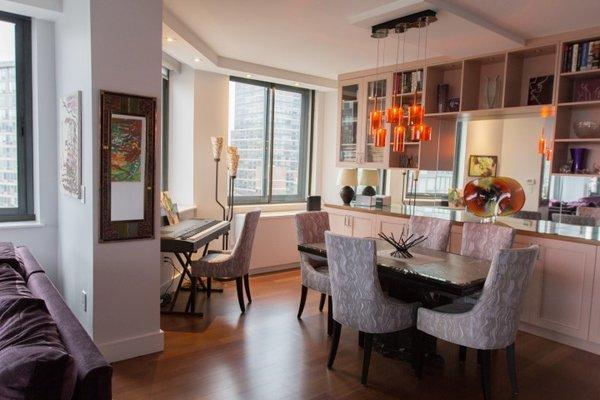 A modified minor wall opens up space between the living room and dining room in this renovation by Eclectic Builders.