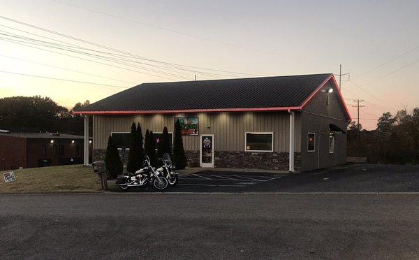 Front of Restaurant, pick up window on right.