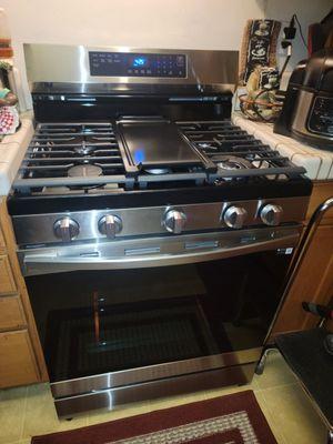 The oven range that was installed and how clean and neat his work area was left.