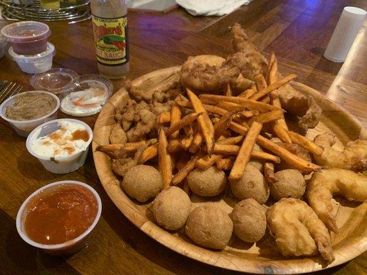 Seafood platter with sweet tater fries.  Delicious.