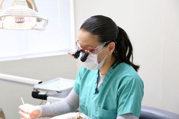 Our dentist focused on her patient.