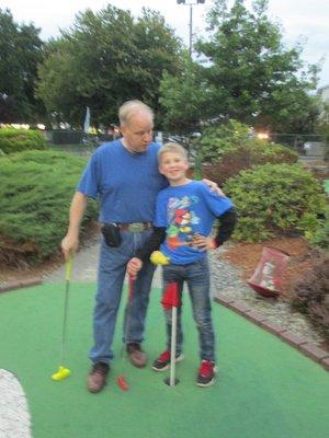 On the links, well...miniature golf,
 with hopefully the next generation of
 tax expert! Fun!