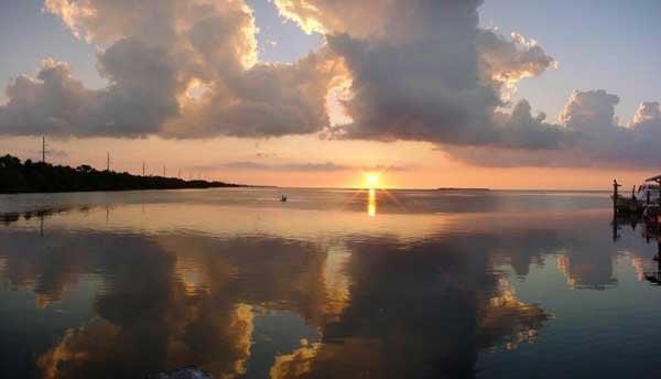 Celebrate the fabulous Florida Keys sunsets from the porch at this comfortable and safe vacation rental - Fla Keys Cottage.