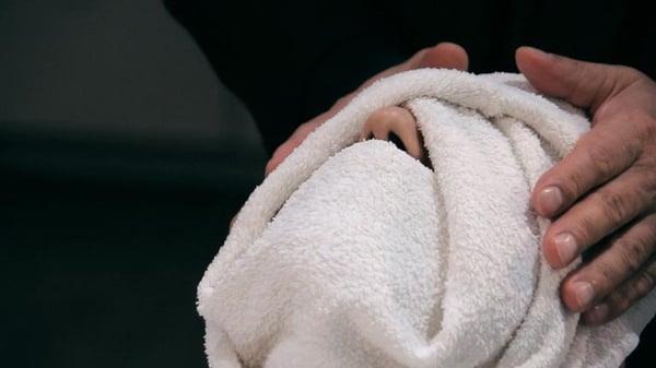 Hot steamed towel, ready for a shave