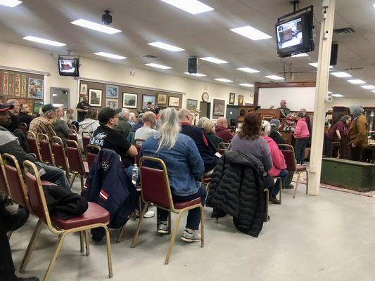 Auctioneer up front