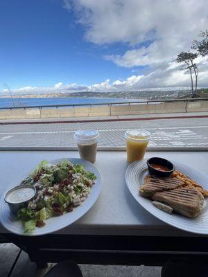 we got the cobb salad and buffalo chicken panini! our drinks are the iced vanilla latte and fresh squeezed oj!!! great vibes!!