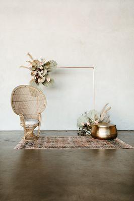 Rose Gold Copper Frame, Tassel Fringe Area Rug in Light Rust, Hammered Gold Coffee Table & Bella Peacock Chair