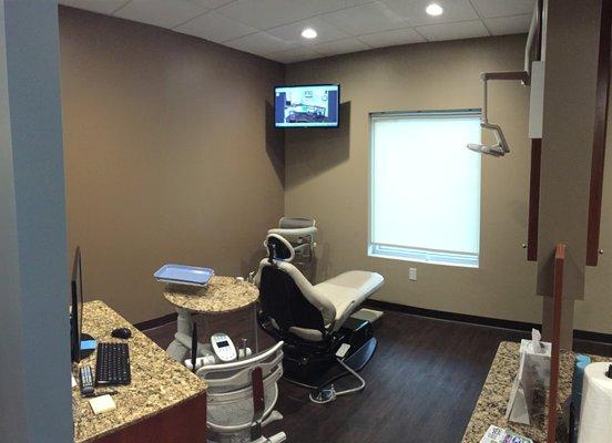 State of the art dental rooms, with television and ultraplush leather chairs.