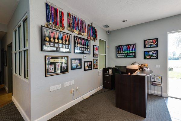 Denny's many medals and our front desk where you will find an agent ready to help you!