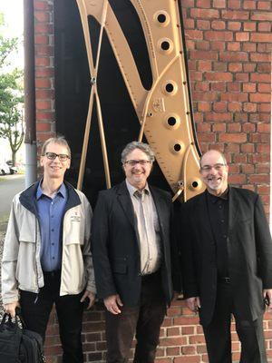 Jacobs School of Music faculty members Luke Gillespie, Konrad Strauss and Norman Krieger at the Hamburg Germany Steinway factory.