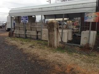 Crates stacked to go take puppies from their dams, so that the breeding can start again. Puppy Mill. Ask to see the parent dogs.