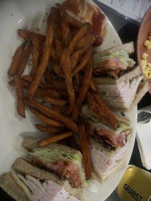 Turkey Club sandwich with sweet potato fries