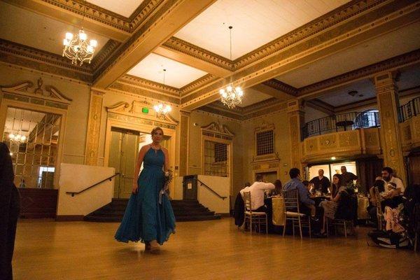 Bridesmaid being introduced into the reception ballroom