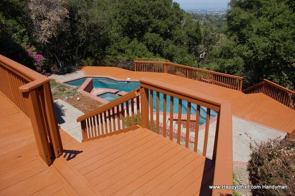 Immaculate deck repair, pressure washing and painting.