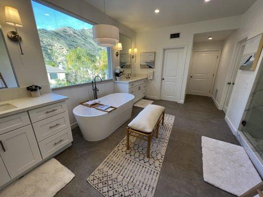 Main bath - All new flooring, custom cabinetry, new shower tile and lighting. Framing work to raise hallway ceiling and remove arch.