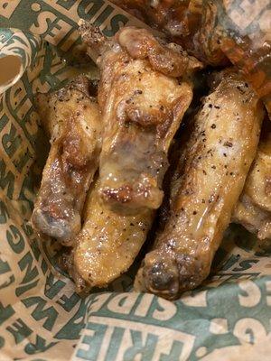 Lemon pepper wings where you can see the build up of grease