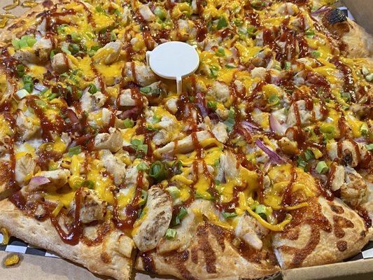 BBQ Chicken Pizza... tons of toppings all the way to the edge.