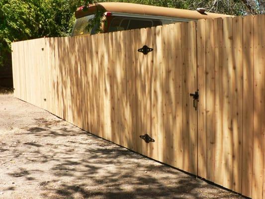 Cedar fence and gate, (next to Greyhound bus)