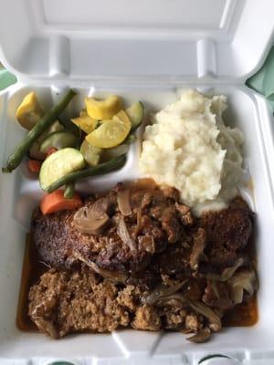 This is delicious meatloaf with a side of mashed potatoes and vegetables this meal was absolutely fantastic