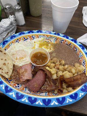 Yummy, a little of everything , ham, bacon, country sausage, pork patties, eggs, potatoes and beans great price!