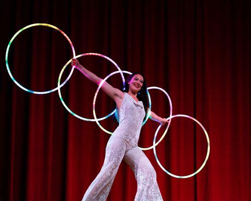 SolAura, wielding hoops on skates at the Colonial Theatre! Please contact us to hear about our curated offerings for your next event!