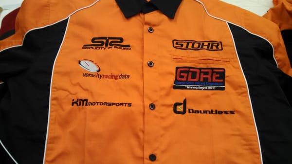 racing crew shirts with lots of embroidery..