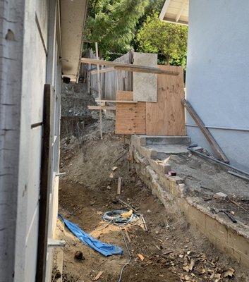 Mangled and uncapped rebar, broken fence, violated neighbor's property line