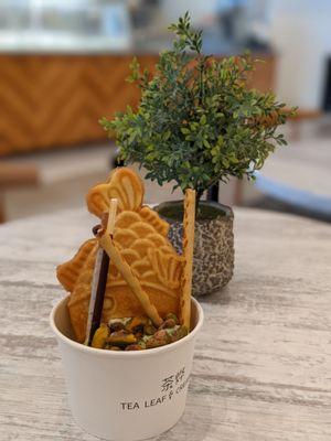 Taiyaki with custard, matcha ice cream, pistachio, Pocky, wafers