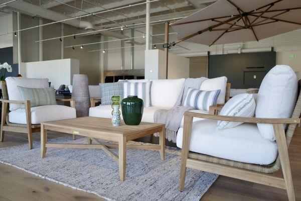 Teak outdoor patio set in our new showroom off Johnson Drive.