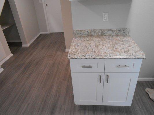 Install cabinets and flooring