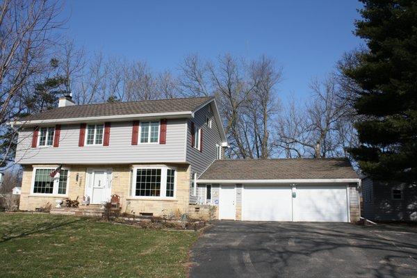 Coverall Home - Here we replaced the roof, siding, windows, gutters, doors, trim & fascia.