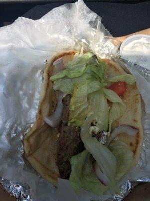 My lamb gyro came with feta, which I didn't order (they charge $1.50 extra) and literally one bite-size piece of tomato...