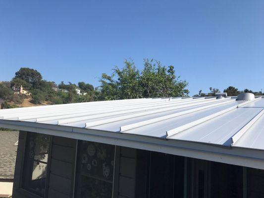 Close up of house edge. Metallic silver metal has a high solar reflectance so it keeps our house cool!