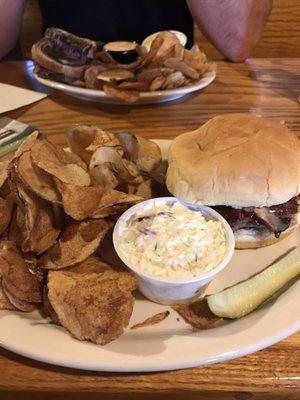 Mushroom Swiss burger with raw fries and cole slaw