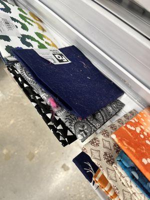 Fabric is strewn about with little rhyme or reason, fat quarters for example and showcasing the dirtiness around the store as well